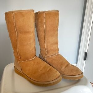 UGG. Classic tall in color sand. Women’s size 8.